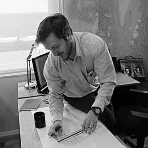 Roi (Rocco) Ramon, kaleidoscope artist and architect, drawing at his drafting table